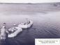 Taking a wounded passenger to a waiting PBY flying boat.