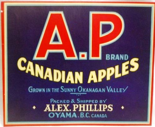 Photo en couleur d’une étiquette de caisse de pommes de la marque A.P. Le fond de l’étiquette est bleu foncé; les bords et les lettres sont rouges, blancs, jaunes et bleu clair.