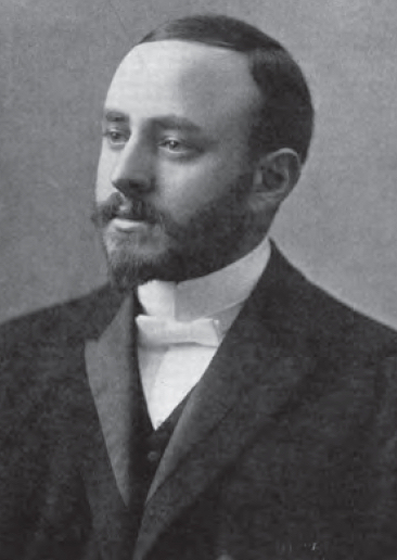 Photographie en noir et blanc datant du début du 20e siècle d’un homme portant une courte barbe et portant un complet. Rabbin Herman Abramowitz.