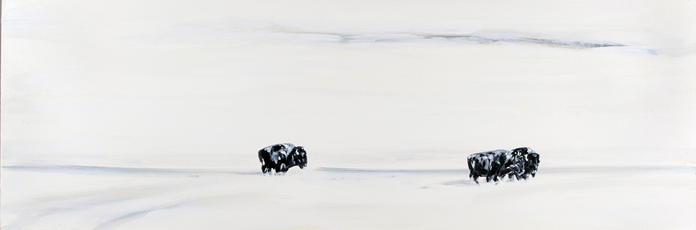 Paysage tout blanc avec trois bisons noirs