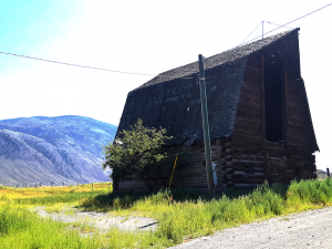 Barn against mountain landscape