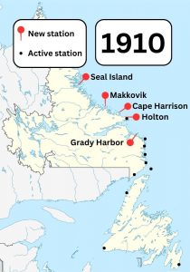 A colour map of Newfoundland and Labrador showing known Marconi wireless stations in the area in 1910. Pins show new stations built in Seal Island, Makkovik, Cape Harrison, Holton, and Grady Harbor.