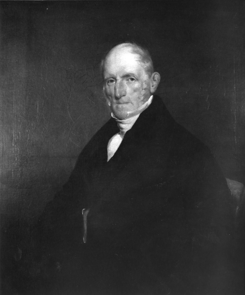 Photographie noir et blanc d’un portrait trois-quarts de Peter Patterson. L’homme âgé porte un élégant habit noir et une chemise blanche.