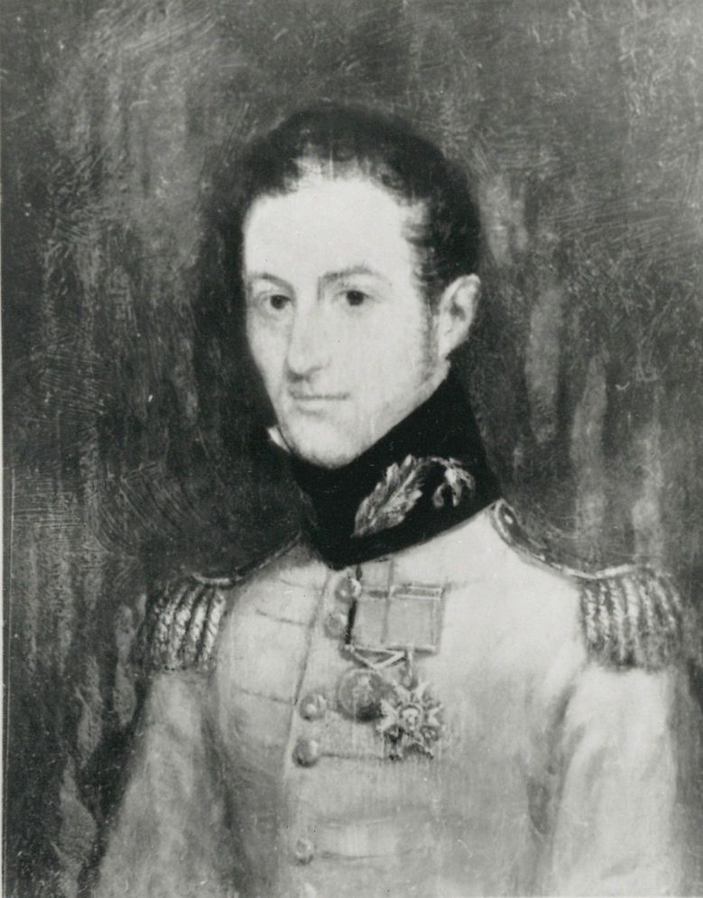 Portrait en noir et blanc d’un homme portant un uniforme militaire britannique orné de deux médailles.