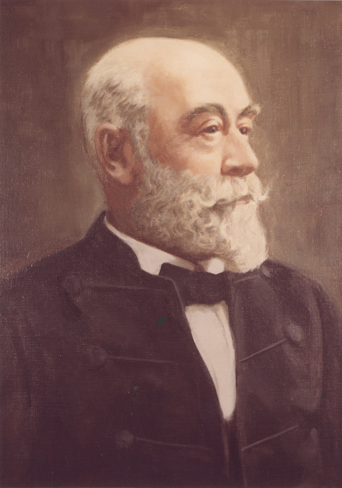 Peinture couleur d’un homme âgé, arborant une barbe blanche. Il porte une chemise blanche avec un nœud papillon ainsi qu’un veston noir par-dessus. 