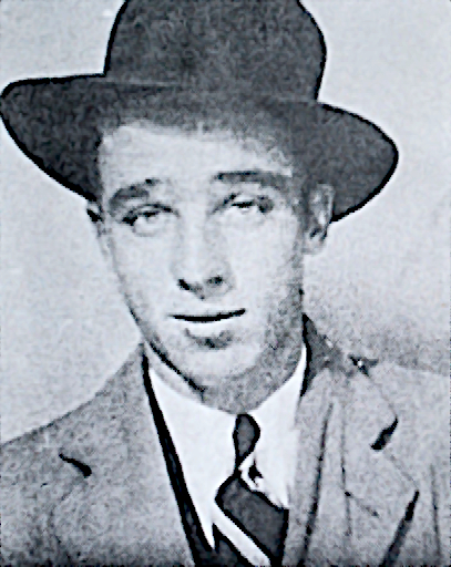 Vieille photo de journal d’un jeune homme portant un chapeau mou, un costume et un manteau