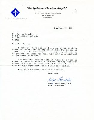 A typewritten letter dated November 12, 1991 from Yodogawa Christian Hospital to Dr. Marion Powell, congratulating her on an award. The letter is typed on white letterhead with Yodogawa Christian Hospital printed in cursive on the top of the letter and a blue diamond symbol with a white cross and the initials YCH in the top left corner.